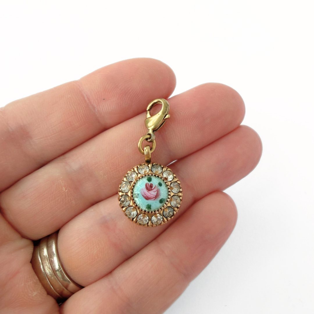 Small vintage hand painted light blue and rhinestone floral charm