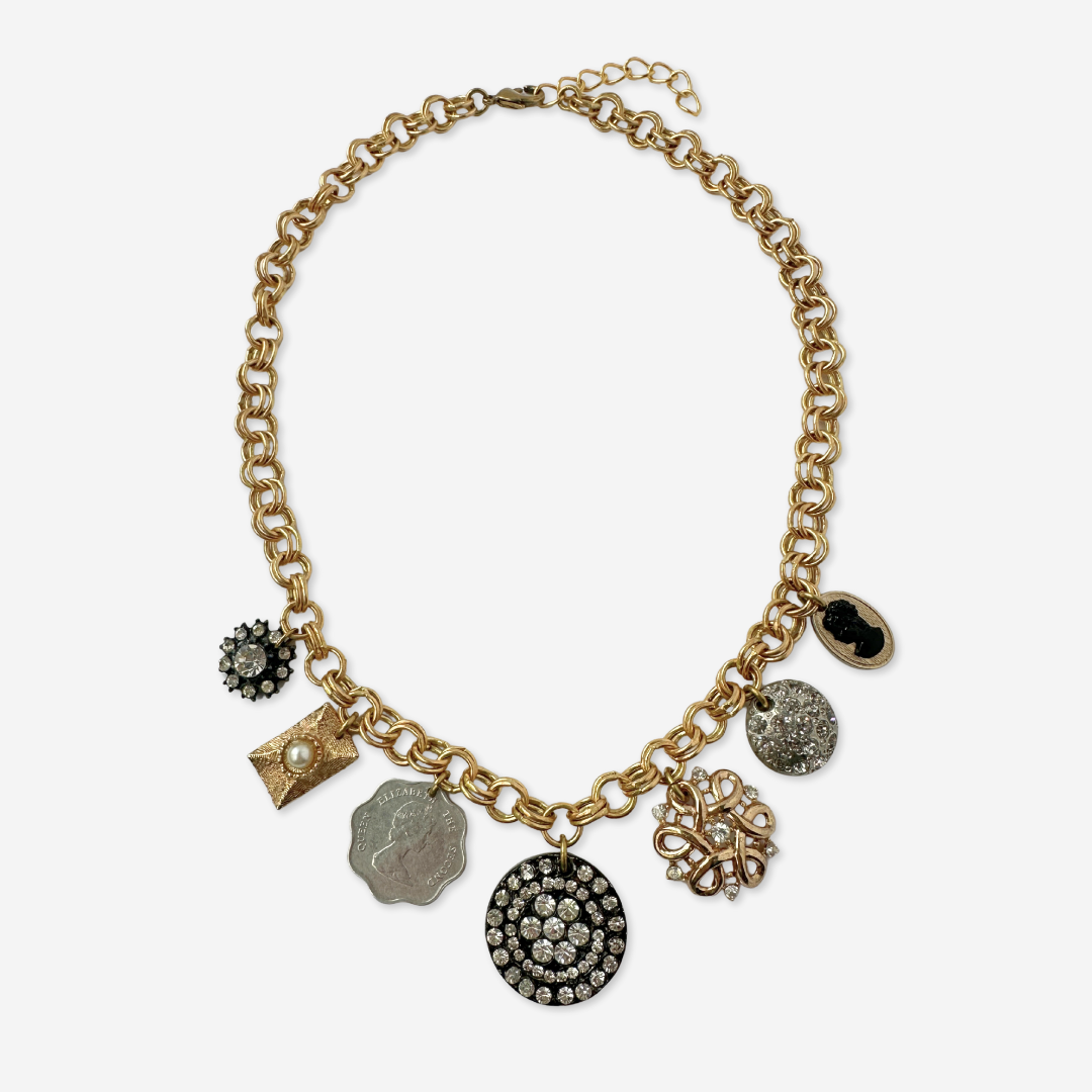 Repurposed vintage neutral charm necklace on gold plated chain