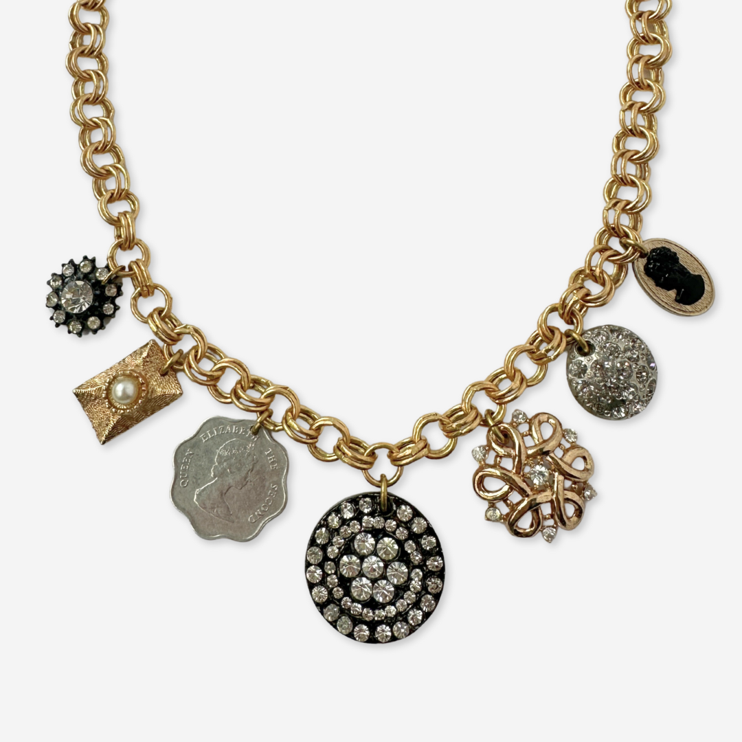 Repurposed vintage neutral charm necklace on gold plated chain