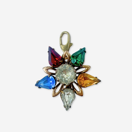Multicolored gemstone pendant on a white background