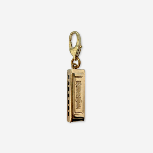 Vintage muted gold harmonica charm pendant
