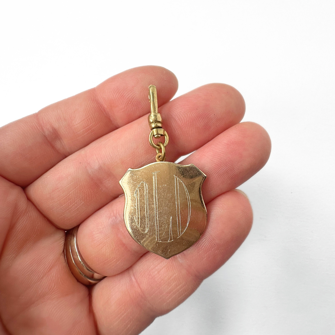 Vintage gold plated large crest charm with "OLD" monogram engraving