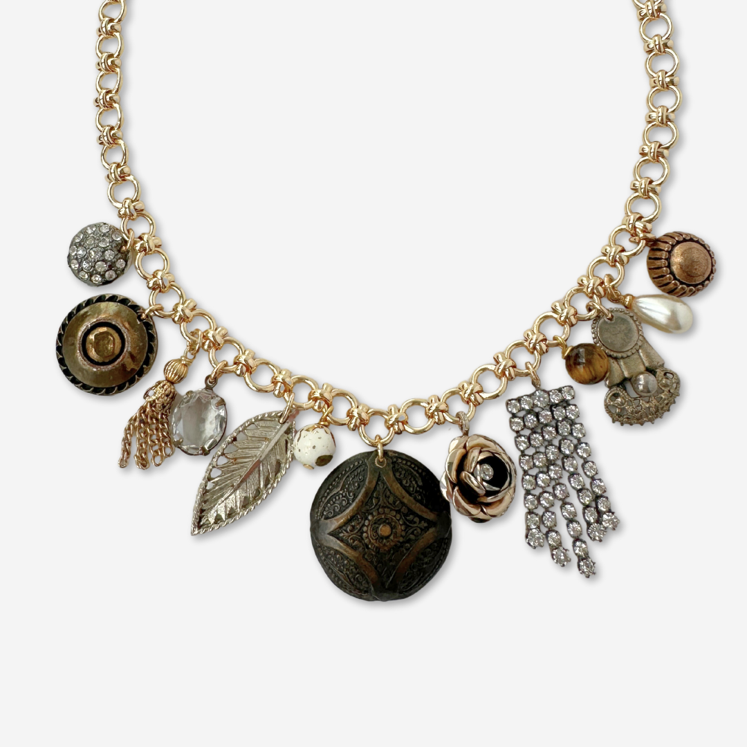 Repurposed vintage neutral charm necklace on gold plated chain