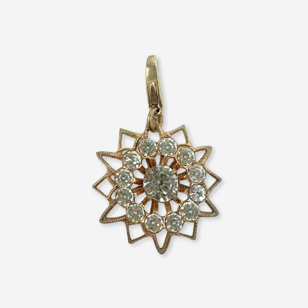 Vintage brass and clear rhinestone sunburst charm