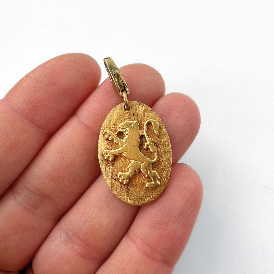 Vintage gold tone Heraldic Lion oval charm