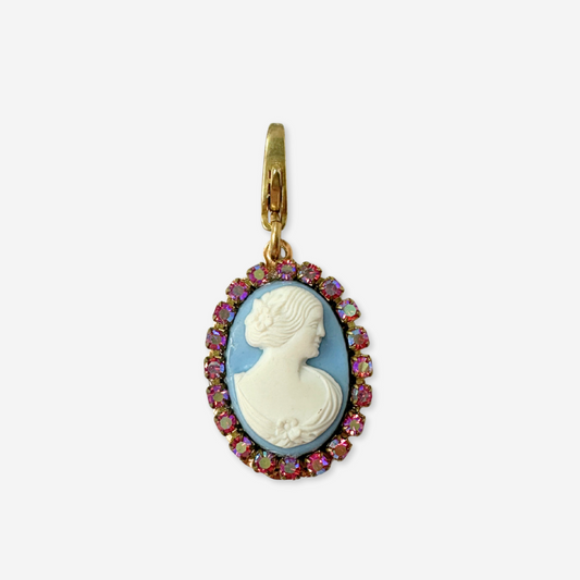 Cameo pendant with colorful gemstones on a white background