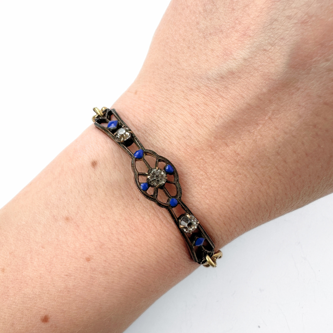 Repurposed antique bronze, blue enamel, and clear rhinestone thin ornate bar bracelet