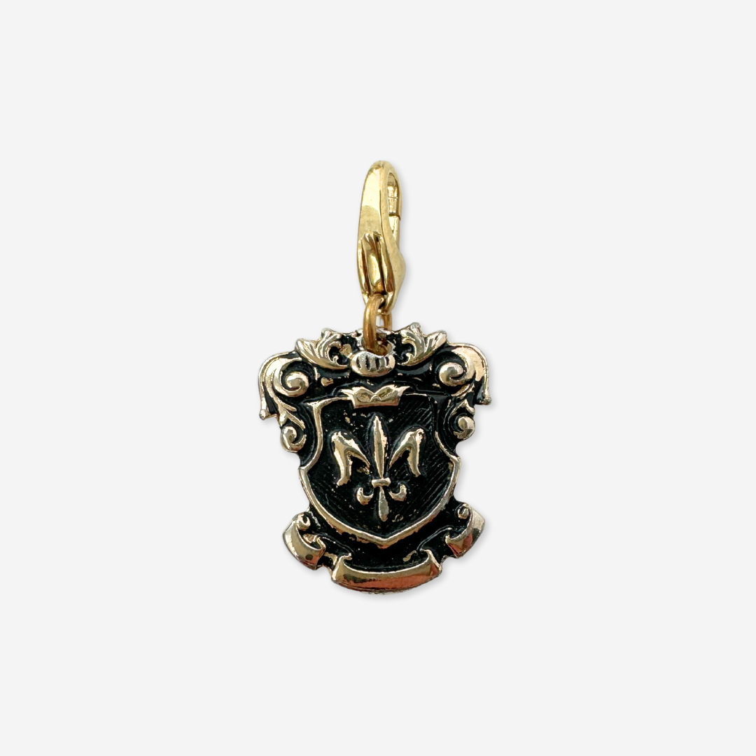 Vintage gold and black enamel fleur de lis shield charm