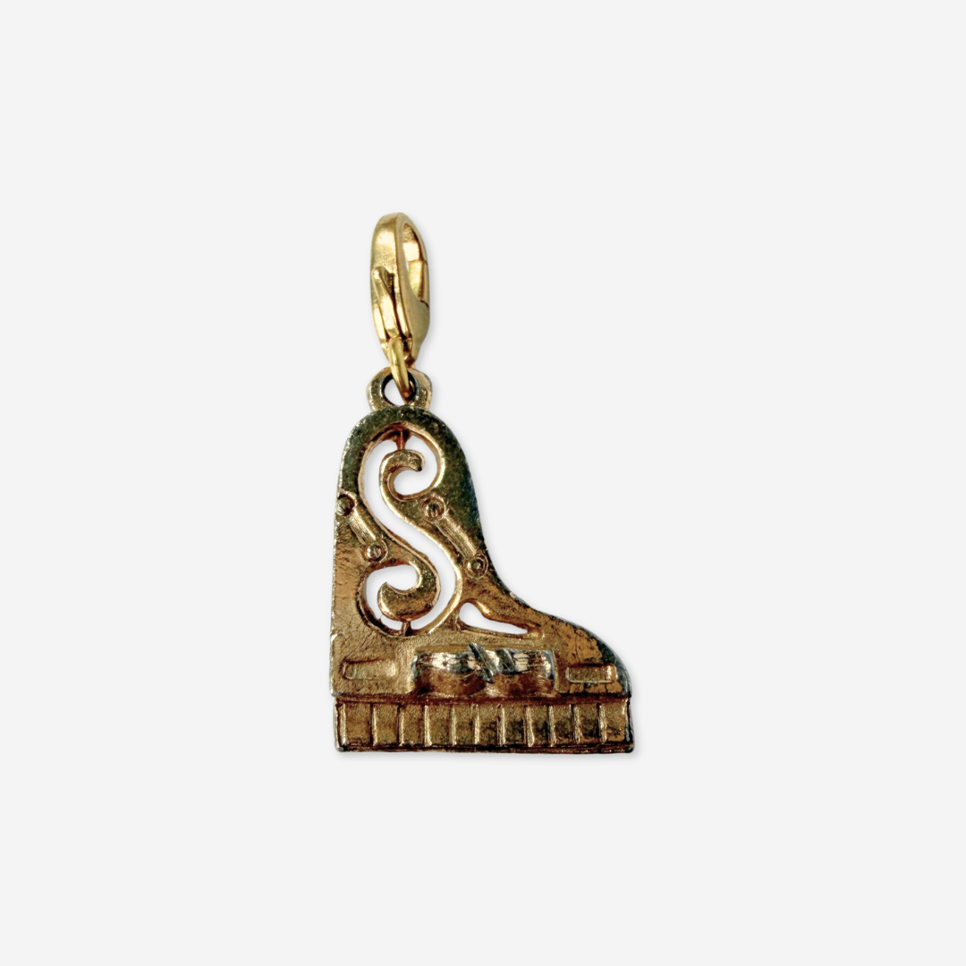 Vintage muted gold tone piano charm