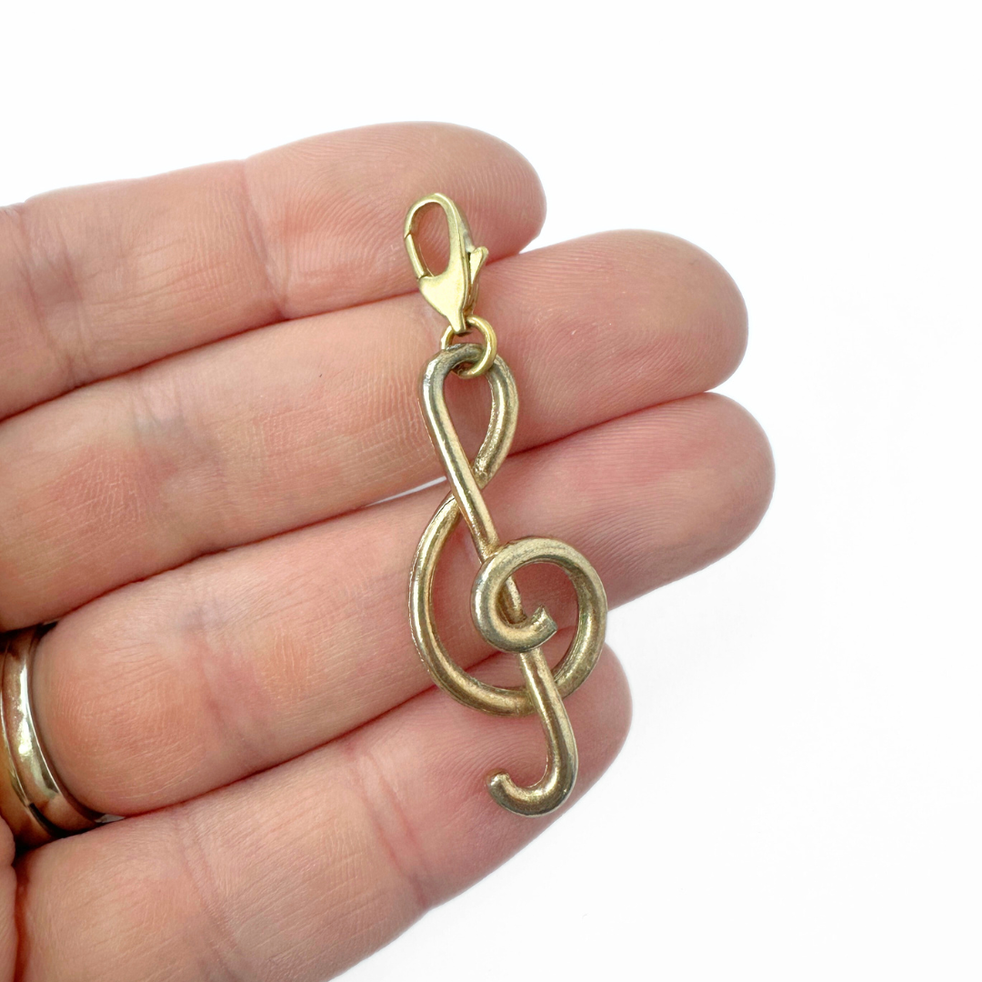 Vintage muted gold treble clef charm pendant