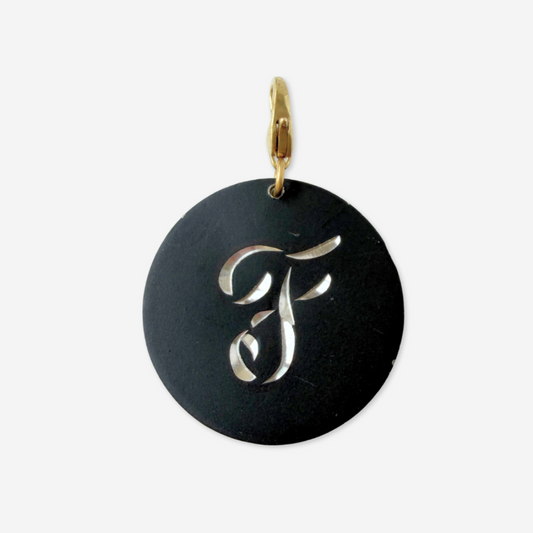 Large vintage black matte circular "F" monogram charm
