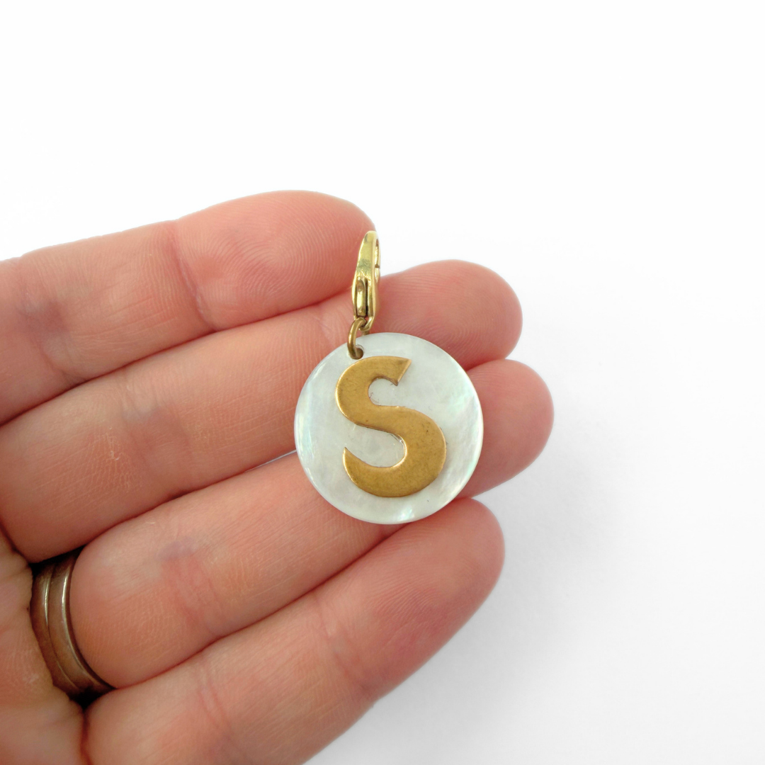 Vintage mother of pearl and brass "S" monogram circular charm