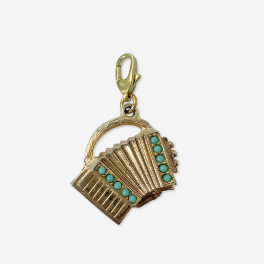 Vintage muted gold accordion charm with turquoise stones