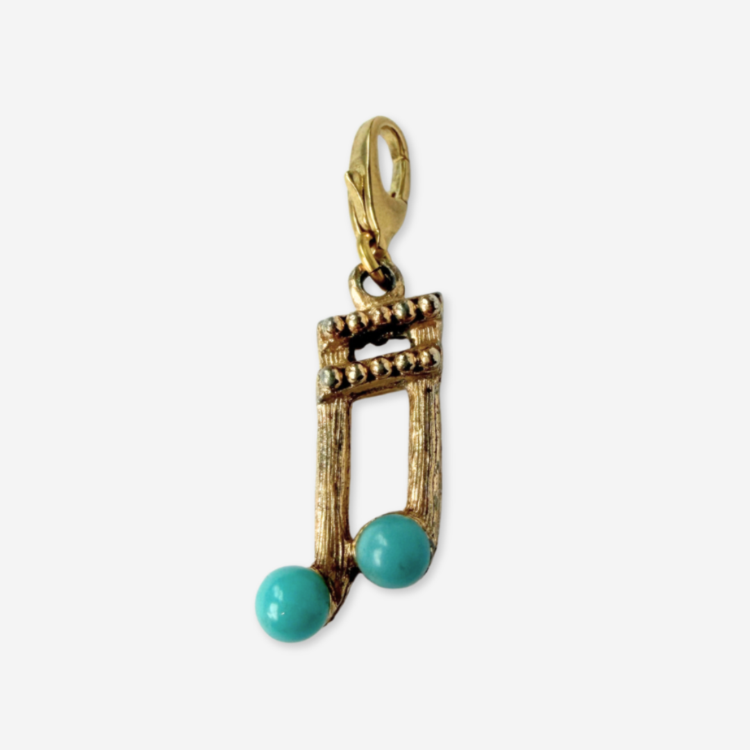 Vintage muted gold music note charm with turquoise accent