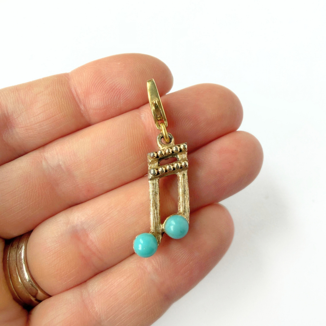 Vintage muted gold music note charm with turquoise accent