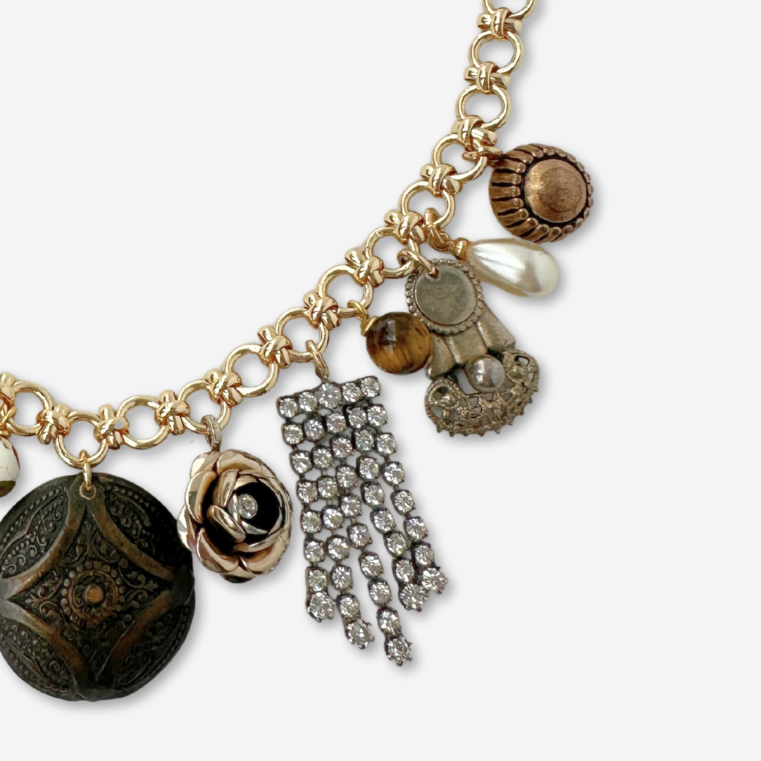 Repurposed vintage neutral charm necklace on gold plated chain