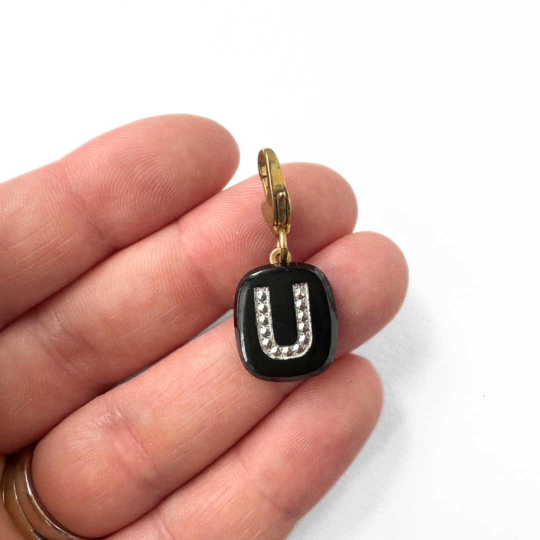 Vintage black glass letter "U" charm