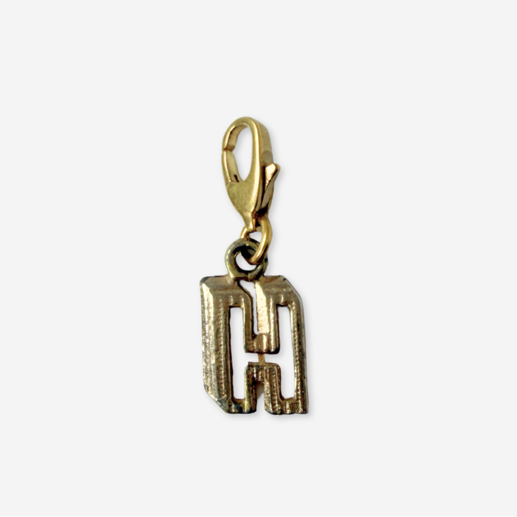 Small vintage gold tone cutout "H" monogram charm
