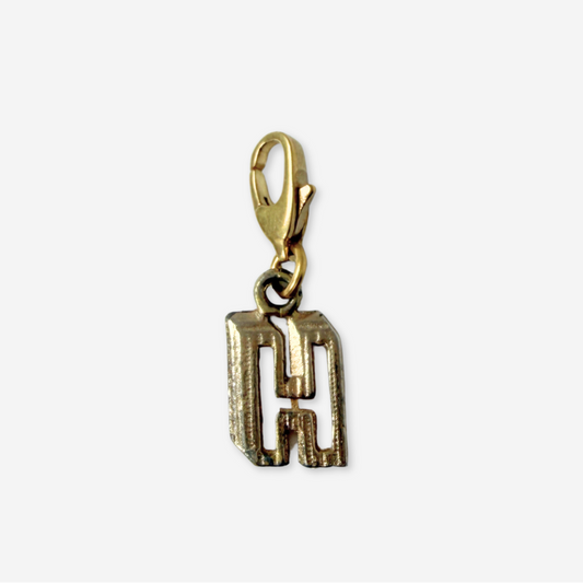 Small vintage gold tone cutout "H" monogram charm