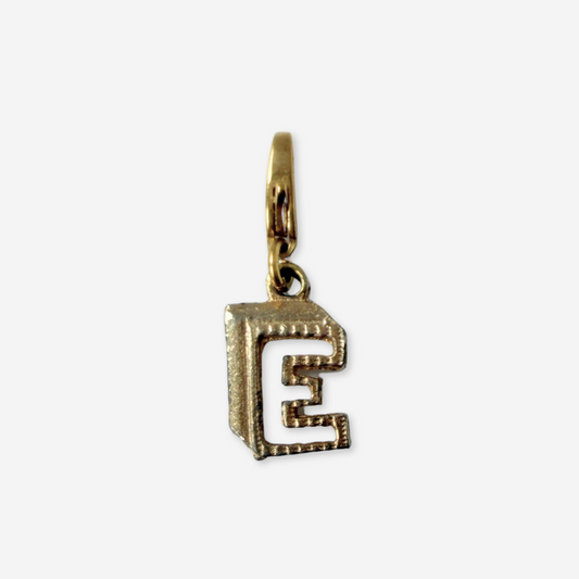Small vintage gold tone cutout "E" monogram charm