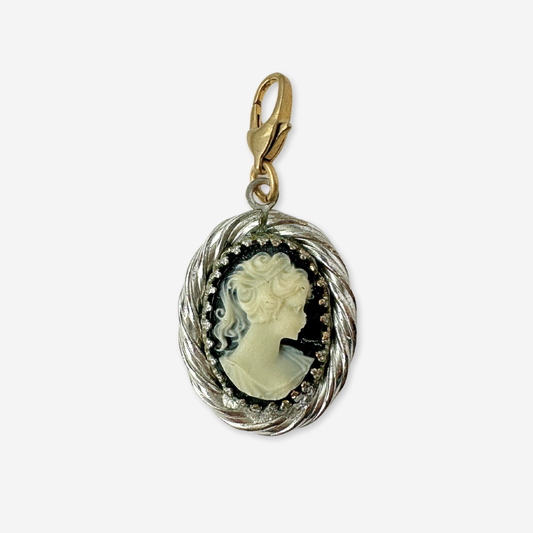 Vintage black and white cameo charm with silver setting and brass clasp