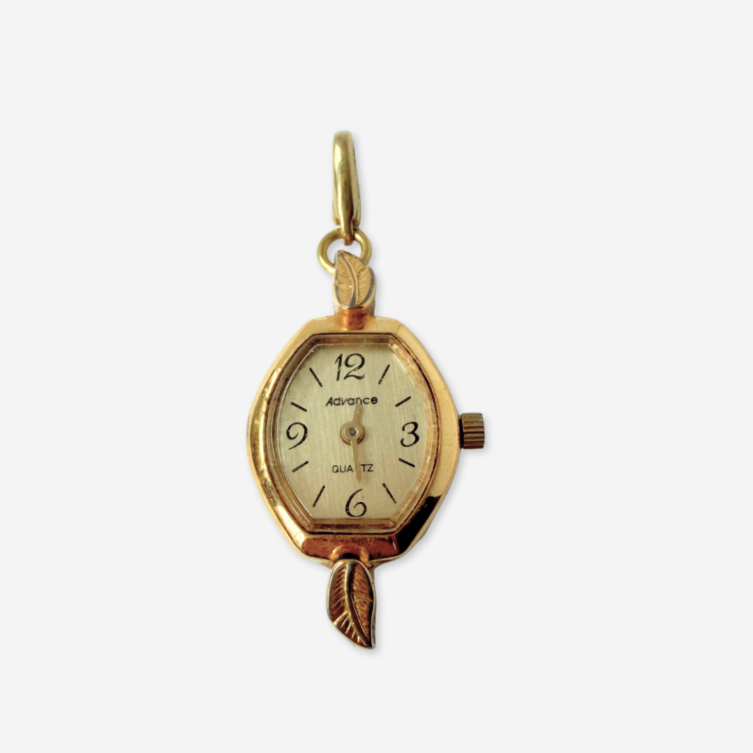 Vintage gold plated "Advance" watch face charm