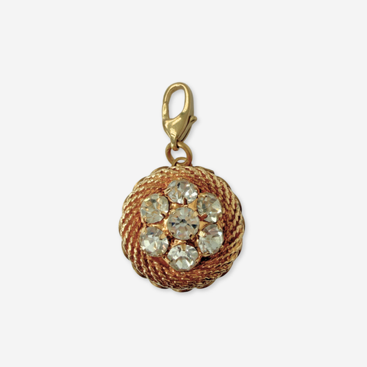 Vintage gold plated circular charm with rhinestone center