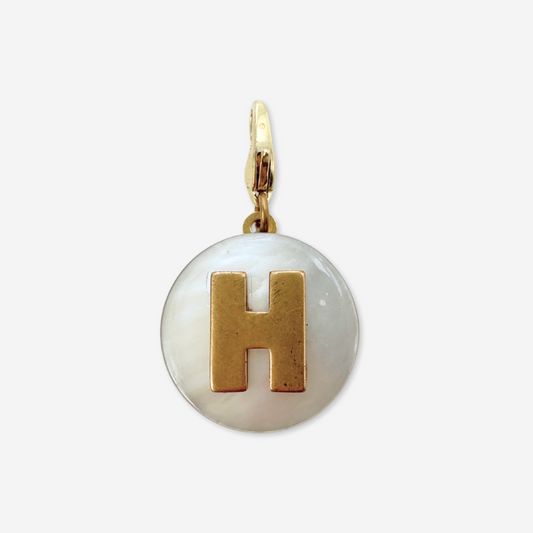 Vintage mother of pearl and brass "H" monogram circular charm