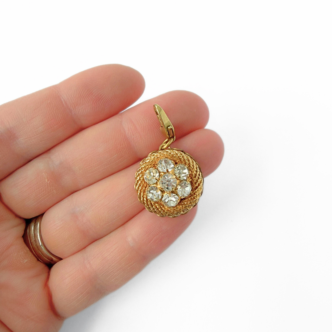 Vintage gold plated circular charm with rhinestone center