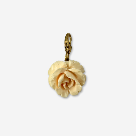 Vintage ivory carved celluloid flower charm