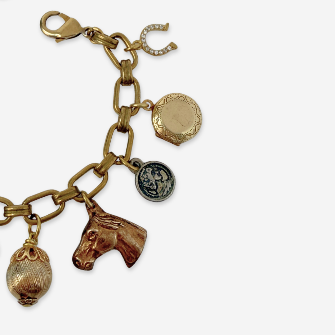 Repurposed vintage mixed neutral charm bracelet