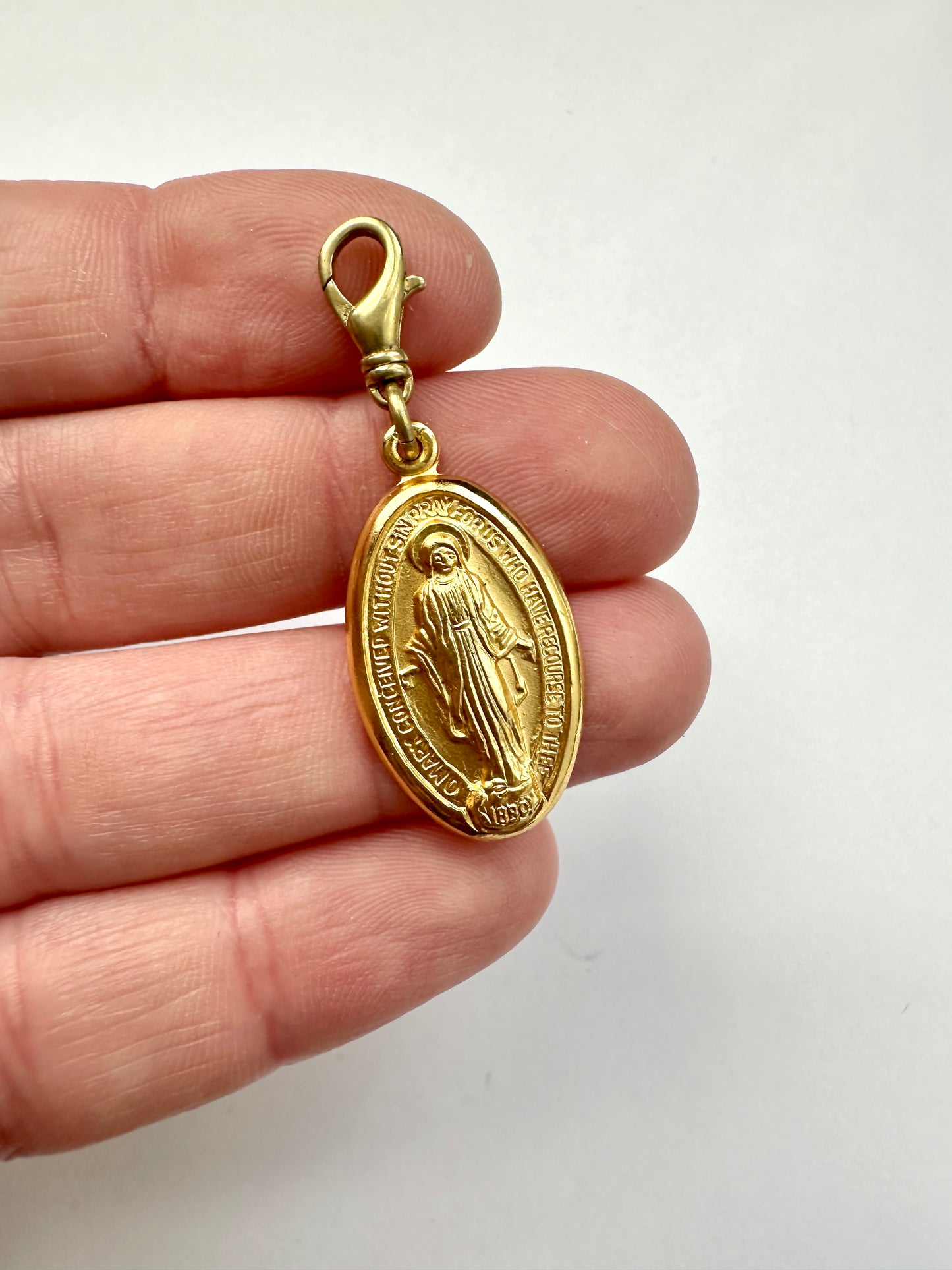 Vintage gold tone miraculous medal charm with brass swivel clasp