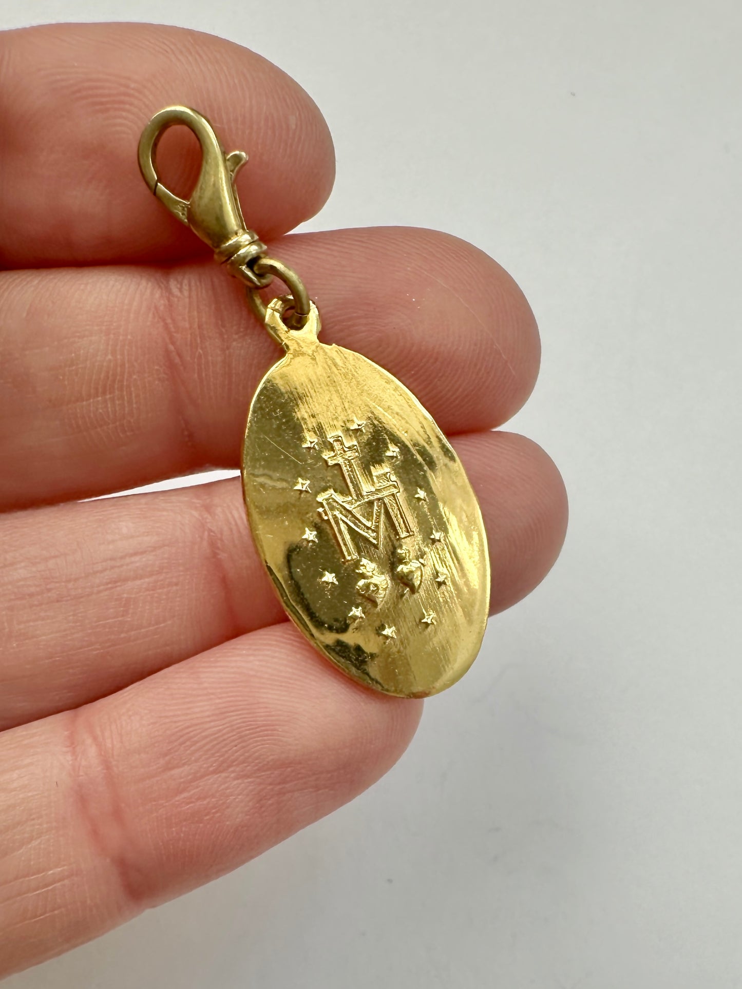 Vintage gold tone miraculous medal charm with brass swivel clasp