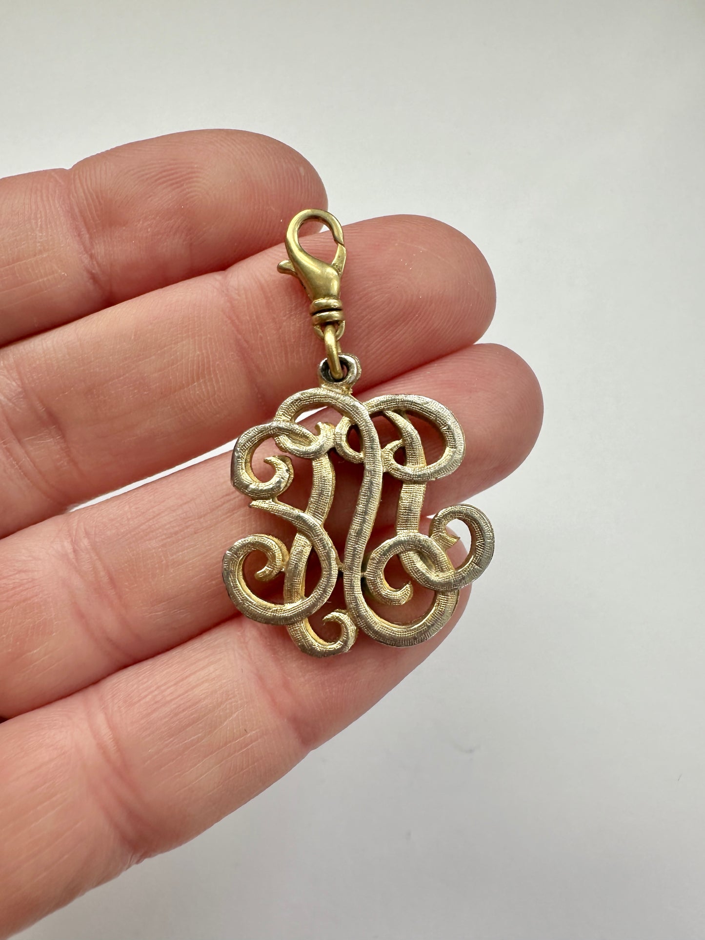 Vintage muted gold "generic monogram" charm with swivel clasp