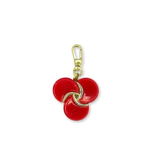 Vintage red thermoset pinwheel charm