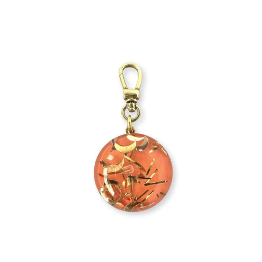 Vintage orange and gold lucite confetti charm with raw brass swivel clasp