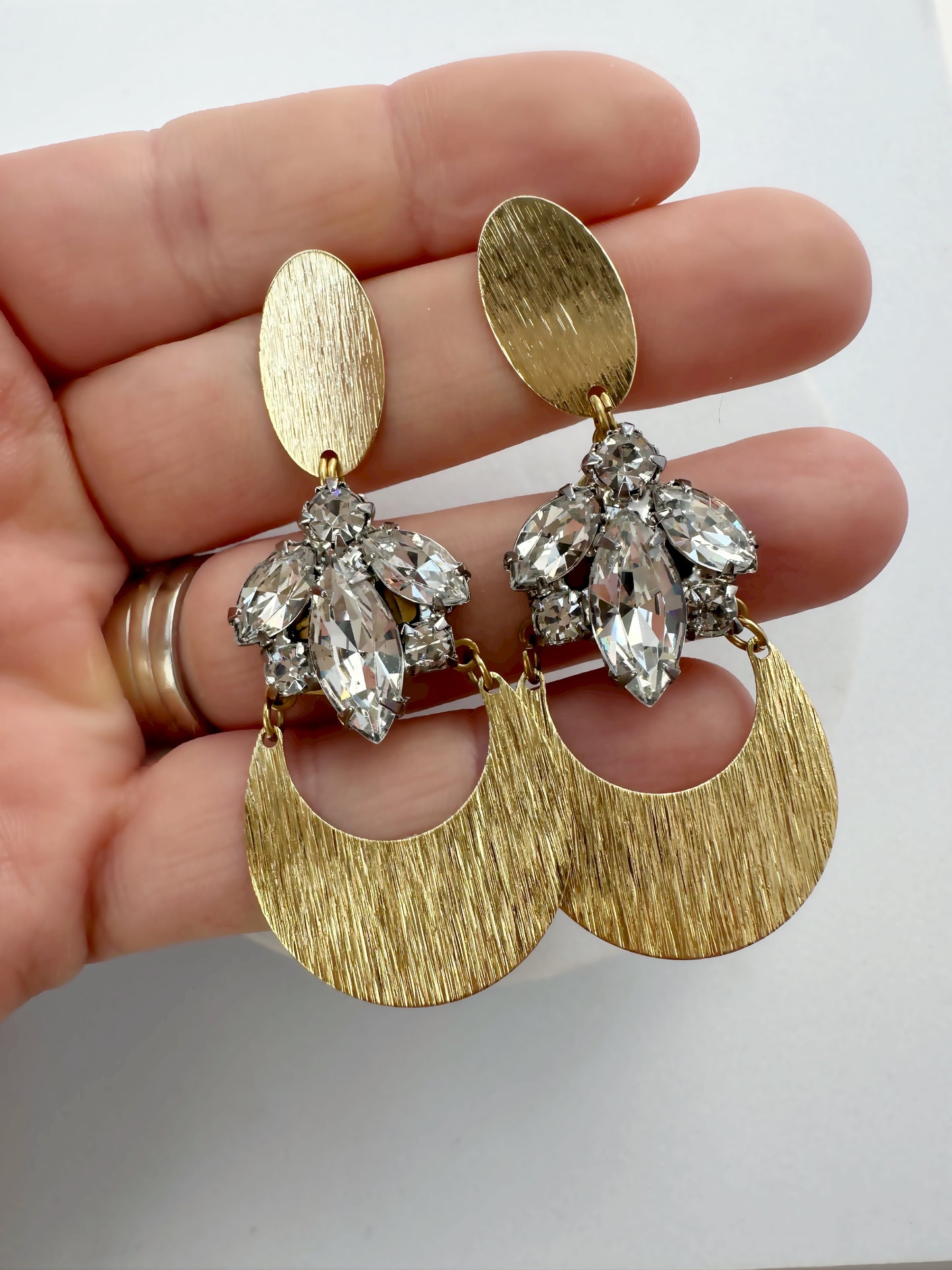 Refashioned vintage clear rhinestone earrings with shiny brass crescent and oval posts