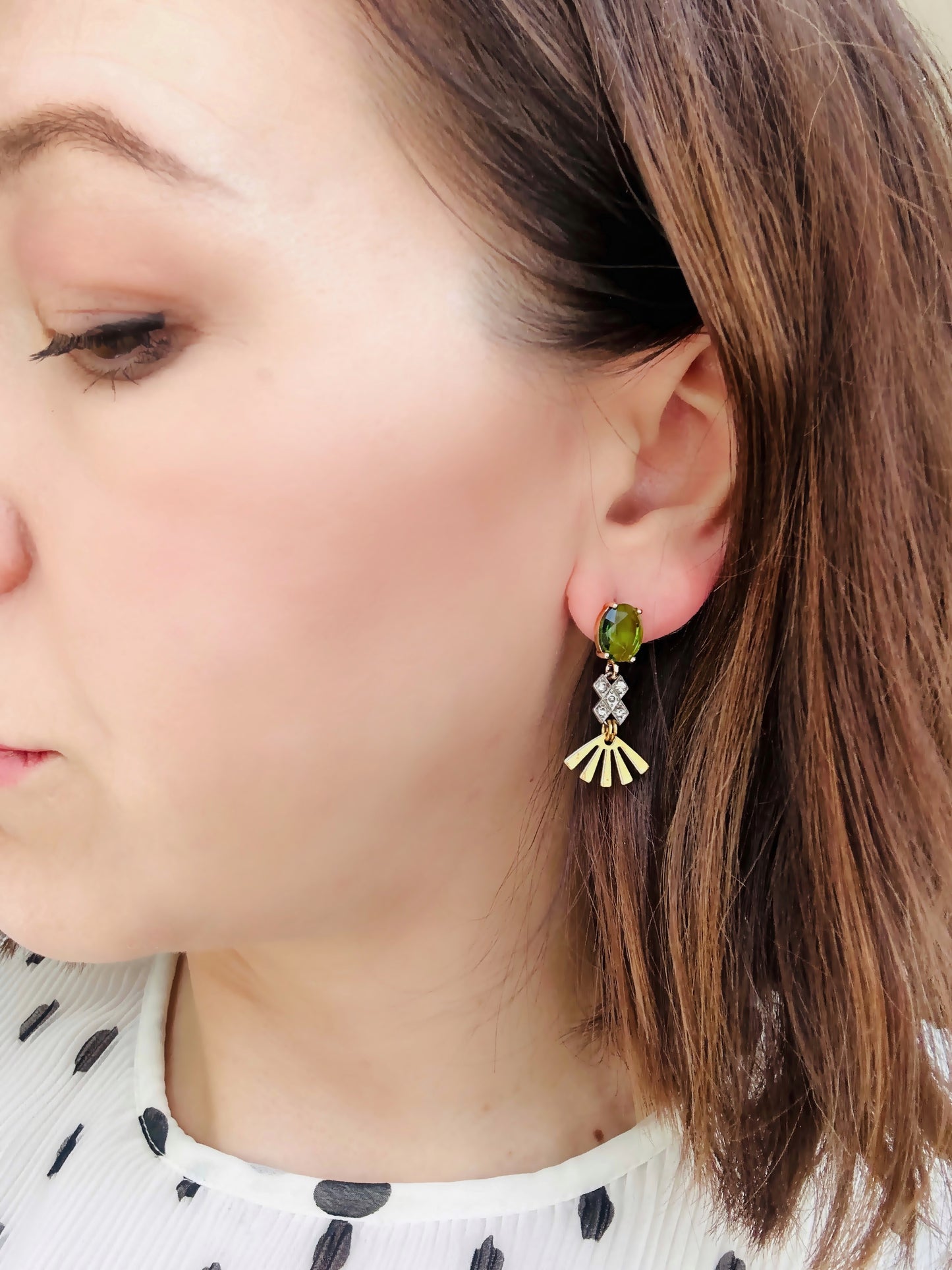 Repurposed vintage rhinestone link earrings with brass sunburst and green crystal post