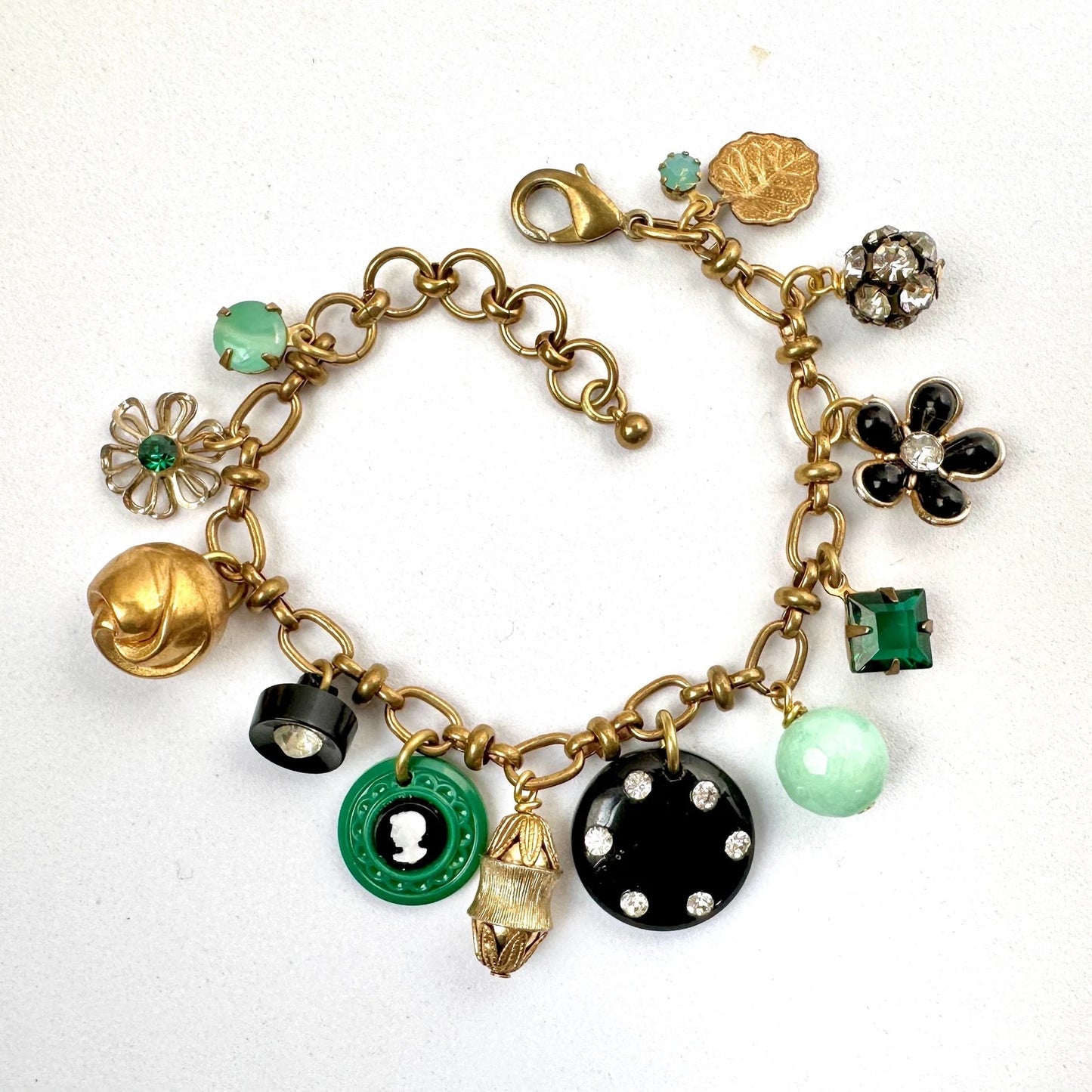 Repurposed vintage charm bracelet on brass chain