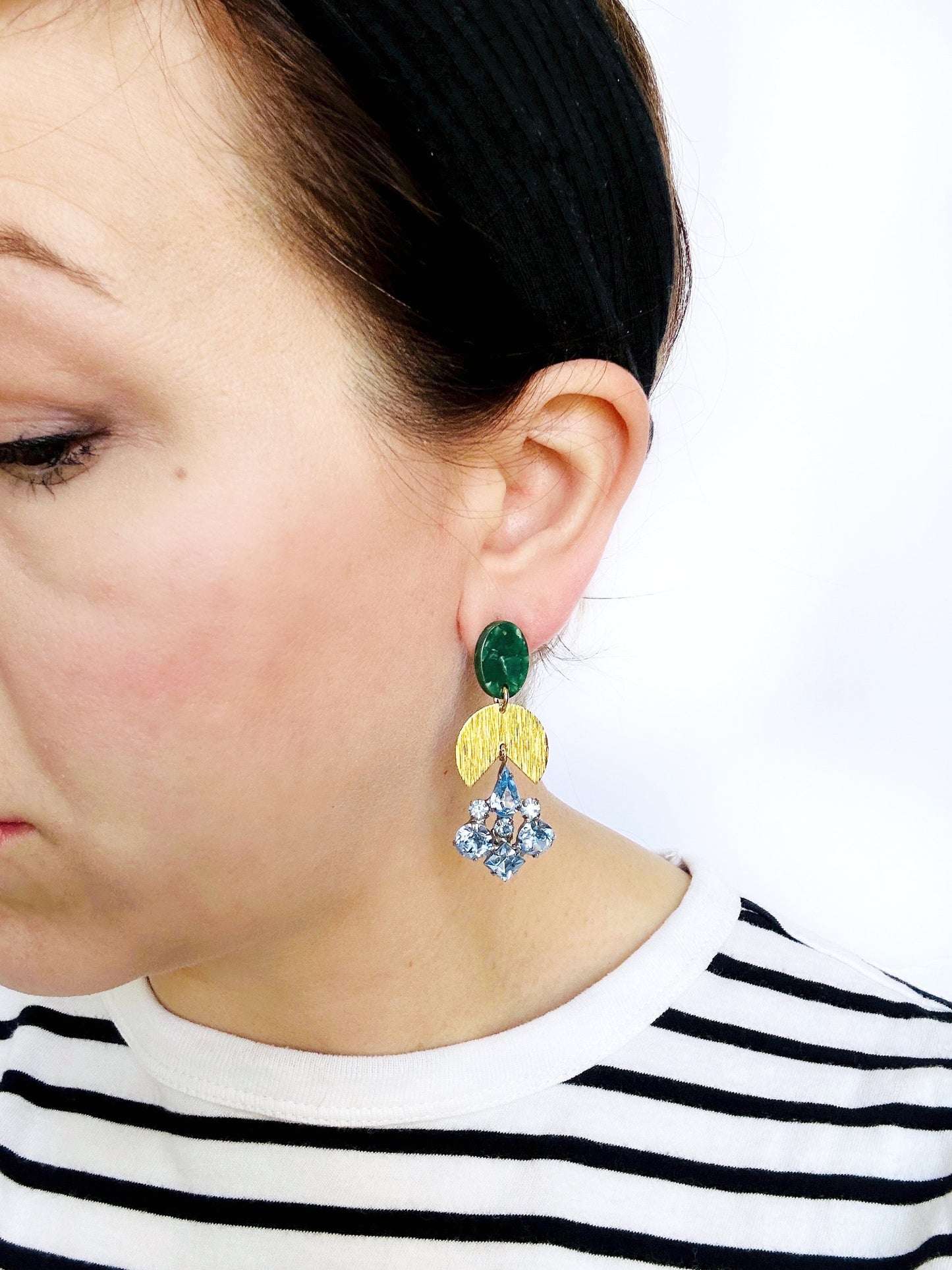 Repurposed vintage light blue rhinestone earrings with brass and green acetate