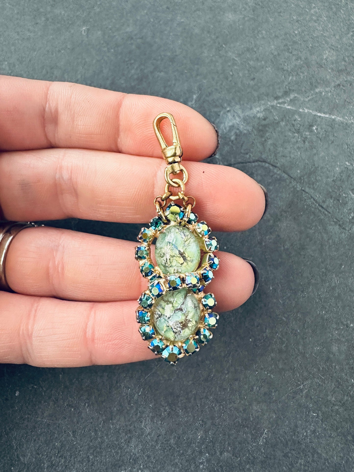 Vintage green and iridescent blue rhinestone charm with raw brass swivel clasp