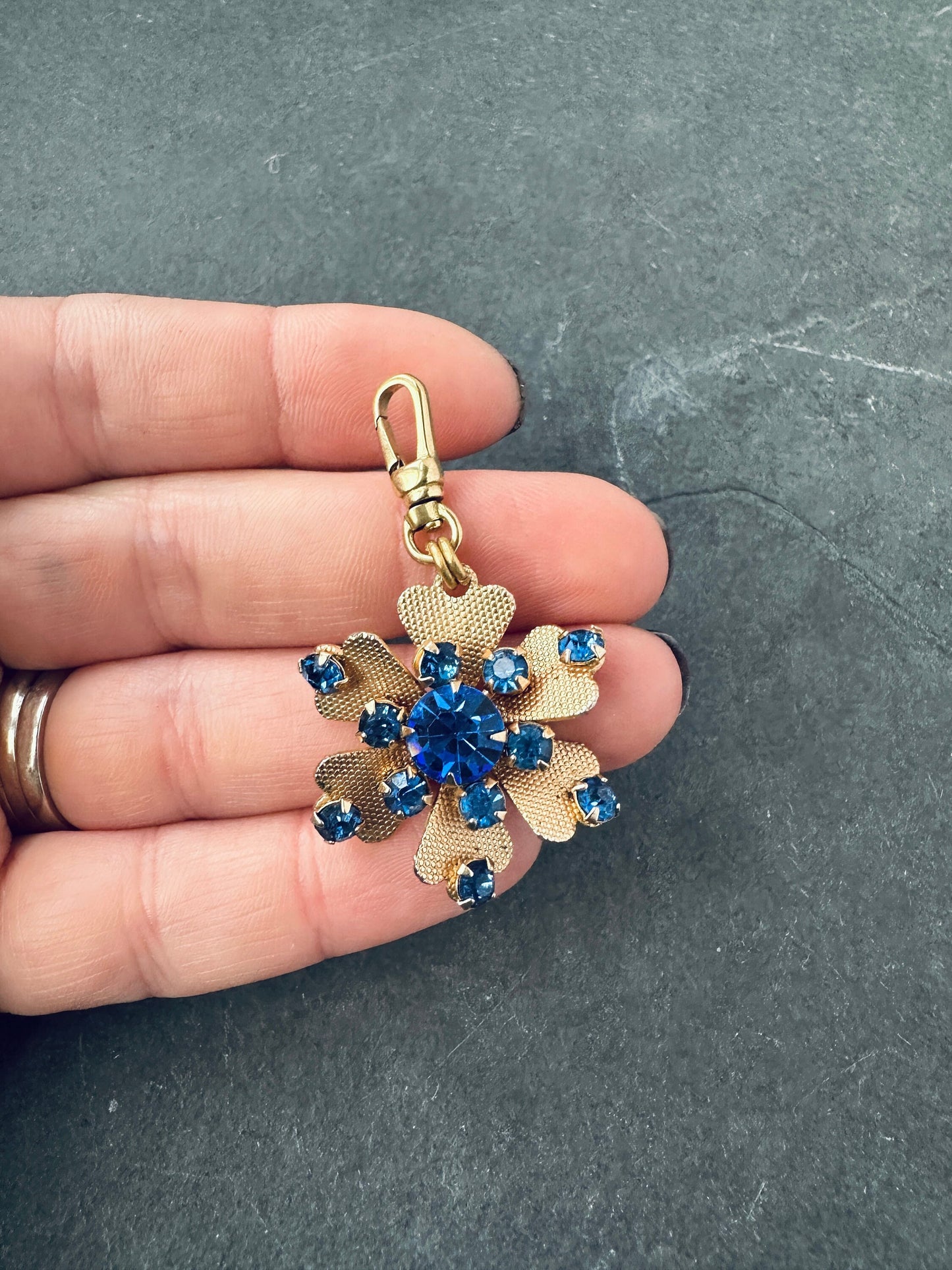 Vintage gold and cobalt blue flower charm with raw brass swivel clasp