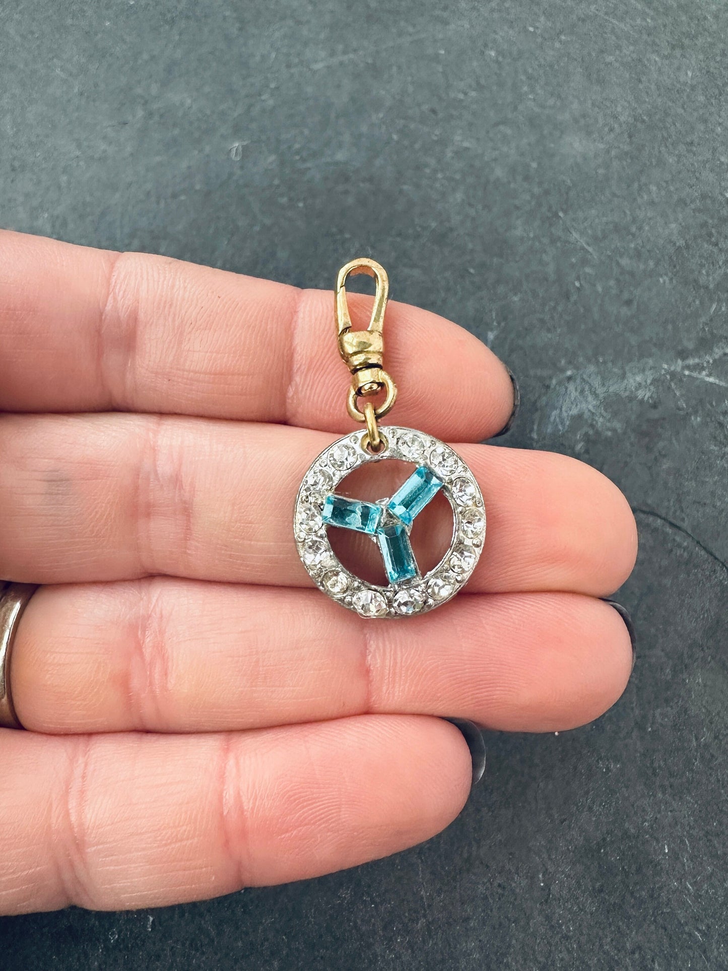 Vintage aqua blue and clear rhinestone circle charm with raw brass swivel clasp